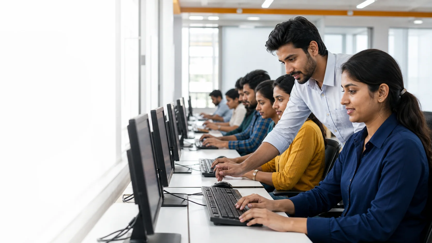 Indian students learning practical computer skills with an instructor at GICT